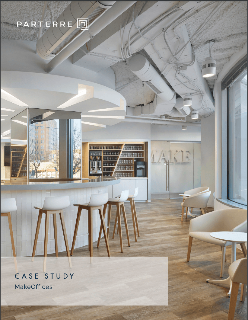 8 Key Elements of Manufacturing Website Design (+Examples From Outstanding Manufacturers) 22 A photo of a modern office space with a curved bar area, white chairs, and luxury vinyl tile flooring. Over the image it reads “Parterre” and “Case Study: MakeOffices.”
